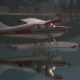 “seaplane flying over Alaskan wilderness”
