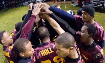 north side high school football players volunteering at elementary school