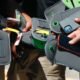 Students using locked smartphone pouches in a classroom