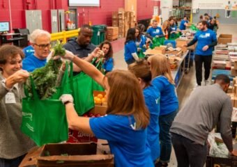 Food Bank of the Rockies volunteers packing food for community