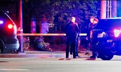 Police officers investigating the scene of the fatal shooting on Fort Wayne's northwest side