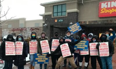 Kroger workers on strike with protest signs