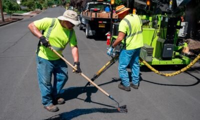 road maintenance crew sealing cracks
