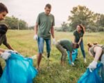 community volunteers picking up trash in a park