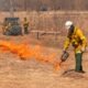 firefighters containing field burn