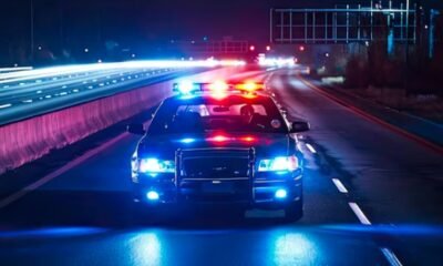 police car at night with flashing lights