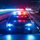 police car at night with flashing lights