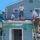 volunteers repairing building roof in Colorado