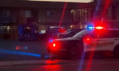 grand junction police car with flashing lights at accident scene