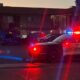 grand junction police car with flashing lights at accident scene