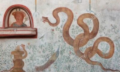 Pompeii lararium mural snakes peacock Anubis Roman shrine volcanic ash preservation