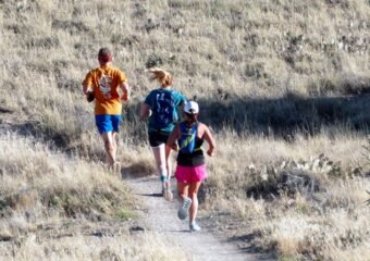 runners on river trail Grand Junction