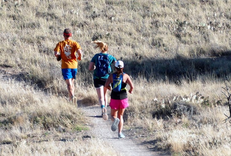 runners on river trail Grand Junction