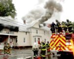 Firefighters Battle Northeast House Blaze