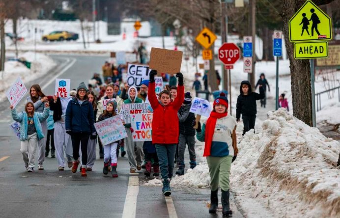  Protesters March Against ICE Shooting