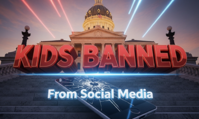 A viral, hyper-realistic YouTube thumbnail with a dramatic cinematic atmosphere. The background is the Indiana Statehouse at golden hour with intense red and blue lighting streaking across the dome. The composition uses a low-angle shot to focus on the main subject: a massive cracked smartphone screen lying shattered on marble steps. The image features massive 3D typography with strict hierarchy: The Primary Text reads exactly: 'KIDS BANNED'. This text is massive, the largest element in the frame, rendered in glowing crimson chrome with sharp metallic edges like a high-budget 3D render. The Secondary Text reads exactly: 'From Social Media'. This text is significantly smaller, positioned below the main text with a thick white outline and electric blue glow effect to contrast against the background. The text materials correspond to the story's concept. Crucial Instruction: There is absolutely NO other text, numbers, watermarks, or subtitles in this image other than these two specific lines. 8k, Unreal Engine 5, cinematic render