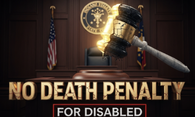A viral, hyper-realistic YouTube thumbnail with a dramatic courtroom atmosphere. The background is a dimly lit Indiana Statehouse chamber with dark wood panels and the state seal glowing faintly on the wall behind an empty judge's bench. The composition uses a low-angle shot to focus on the main subject: a massive, cracked marble gavel hovering mid-air above the bench, split down the middle with one half glowing gold and the other half dark and crumbling. The image features massive 3D typography with strict hierarchy: The Primary Text reads exactly: 'NO DEATH PENALTY'. This text is massive, the largest element in the frame, rendered in polished gold chrome with dramatic rim lighting to look like a high-budget 3D render. The Secondary Text reads exactly: 'FOR DISABLED'. This text is significantly smaller, positioned below the main text with a thick red outline and subtle cracked texture to contrast against the background. The text materials correspond to the story's concept. Crucial Instruction: There is absolutely NO other text, numbers, watermarks, or subtitles in this image other than these two specific lines. 8k, Unreal Engine 5, cinematic render