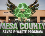 A viral, hyper-realistic YouTube thumbnail with a bold environmental tech atmosphere. The background is the Mesa County Hazardous Waste Facility exterior at golden hour with recycling trucks and stacked electronics visible through open bay doors, warm Colorado sunset lighting. The composition uses a dramatic low-angle shot to focus on the main subject: a massive glowing green recycling symbol made of circuit boards and crushed electronics rising like a phoenix. The image features massive 3D typography with strict hierarchy: The Primary Text reads exactly: 'MESA COUNTY'. This text is massive, the largest element in the frame, rendered in brushed aluminum chrome with electric green edge lighting to look like a high-budget 3D render. The Secondary Text reads exactly: 'SAVES E-WASTE PROGRAM'. This text is significantly smaller, positioned below the main text with thick white glow outline and subtle circuit trace effects to contrast against the background. Make sure text 2 is always different theme, style, effect and border compared to text 1. The text materials correspond to the story's concept. Crucial Instruction: There is absolutely NO other text, numbers, watermarks, or subtitles in this image other than these two specific lines. 8k, Unreal Engine 5, cinematic render