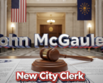 A viral, hyper-realistic YouTube thumbnail with a patriotic political atmosphere. The background is the grand marble hallway of Fort Wayne City Hall with American and Indiana flags softly waving. The composition uses a dramatic low-angle shot to focus on the main subject: a polished wooden gavel resting on official city seal documents. The image features massive 3D typography with strict hierarchy: The Primary Text reads exactly: 'John McGauley'. This text is massive, the largest element in the frame, rendered in gleaming chrome with subtle red and blue glow to look like a high-budget 3D render. The Secondary Text reads exactly: 'New City Clerk'. This text is significantly smaller, positioned below the main text. It features a thick white border with red outline sticker style to contrast against the background. Make sure text 2 is always different theme, style, effect and border compared to text 1. The text materials correspond to the story's concept. Crucial Instruction: There is absolutely NO other text, numbers, watermarks, or subtitles in this image other than these two specific lines. 8k, Unreal Engine 5, cinematic render