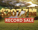 A viral, hyper-realistic YouTube thumbnail with a luxury real estate atmosphere. The background is a sweeping aerial view of the lush Canterbury Green campus at golden hour with the golf course greens glowing and swimming pools reflecting warm sunlight. The composition uses a dramatic low-angle cinematic shot to focus on the main subject: a massive, gleaming golden sold sign staked into perfect grass. The image features massive 3D typography with strict hierarchy: The Primary Text reads exactly: '$207.7M'. This text is massive, the largest element in the frame, rendered in polished gold chrome with realistic reflections to look like a high-budget 3D render. The Secondary Text reads exactly: 'RECORD SALE'. This text is significantly smaller, positioned below the main text with a bold red outline and slight glow effect to contrast against the background. Make sure text 2 is always different theme, style, effect and border compared to text 1. The text materials correspond to the story's concept. Crucial Instruction: There is absolutely NO other text, numbers, watermarks, or subtitles in this image other than these two specific lines. 8k, Unreal Engine 5, cinematic render.
