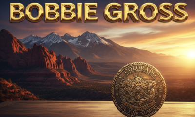 A viral, hyper-realistic YouTube thumbnail with a bold patriotic Colorado atmosphere. The background is a dramatic Western Slope sunset over red rock mesas and snow-capped peaks with golden dramatic lighting. The composition uses a low-angle heroic shot to focus on the main subject: a large, polished bronze Colorado state seal glowing on a wooden desk. The image features massive 3D typography with strict hierarchy: The Primary Text reads exactly: 'BOBBIE GROSS'. This text is massive, the largest element in the frame, rendered in molten gold chrome to look like a high-budget 3D render. The Secondary Text reads exactly: 'NEW WESTERN CHAIR'. This text is significantly smaller, positioned below the main text with a thick white outline and red sticker-style border to contrast against the sunset sky. The text materials correspond to the story's concept. Crucial Instruction: There is absolutely NO other text, numbers, watermarks, or subtitles in this image other than these two specific lines. 8k, Unreal Engine 5, cinematic render
