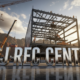 A viral, hyper-realistic YouTube thumbnail with a bold, energetic construction site atmosphere. The background is a massive active job site at golden hour with Grand Junction red rock mountains behind, cranes lifting steel beams, workers in hard hats, warm dramatic sunlight cutting through dust clouds. The composition uses a dramatic low-angle shot looking up to emphasize scale and power on the main subject: a huge gleaming steel framework of the future recreation center rising from the ground. The image features massive 3D typography with strict hierarchy: The Primary Text reads exactly: 'GJ REC CENTER'. This text is massive, the largest element in the frame, rendered in polished chrome with realistic reflections and edge glow to look like a high-budget 3D render. The Secondary Text reads exactly: 'OPENING 2026'. This text is significantly smaller, positioned below the main text with thick orange outline and subtle motion blur effect to contrast against the sky. The text materials correspond to the story's concept. Crucial Instruction: There is absolutely NO other text, numbers, watermarks, or subtitles in this image other than these two specific lines. 8k, Unreal Engine 5, cinematic render.