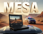 A viral, hyper-realistic YouTube thumbnail with a high-tech desert law enforcement atmosphere. The background is a dramatic Western Colorado red-rock canyon at golden hour with a Mesa County Sheriff patrol truck kicking up dust in the distance, emergency lights flashing. The composition uses a low-angle cinematic shot to focus on the main subject: a rugged Panasonic TOUGHBOOK 55 laptop dramatically open on the hood of a sheriff SUV, screen glowing bright with body-cam footage playing. The image features massive 3D typography with strict hierarchy: The Primary Text reads exactly: 'MESA COUNTY'. This text is massive, the largest element in the frame, rendered in brushed gunmetal chrome with orange emergency-light reflections to look like a high-budget 3D render. The Secondary Text reads exactly: 'DROPS $764K ON 5G'. This text is significantly smaller, positioned below the main text. It features a thick, glowing neon-orange border/outline (sticker style) to contrast against the desert background. Make sure text 2 is always different theme, style, effect and border compared to text 1. The text materials correspond to the story's concept. Crucial Instruction: There is absolutely NO other text, numbers, watermarks, or subtitles in this image other than these two specific lines. 8k, Unreal Engine 5, cinematic render