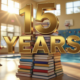 A viral, hyper-realistic YouTube thumbnail with a warm, golden-hour community atmosphere. The background is the sunlit lobby of Fruita Community Center with blurred kids running toward the climbing wall and pool light dancing on the floor. The composition uses a low-angle cinematic shot to focus on the main subject: a towering stack of colorful library books morphing into a basketball hoop. The image features massive 3D typography with strict hierarchy: The Primary Text reads exactly: '15 YEARS'. This text is massive, the largest element in the frame, rendered in polished gold chrome with subtle light flares to look like a high-budget 3D render. The Secondary Text reads exactly: 'Fruita Library + Rec Center'. This text is significantly smaller, positioned below the main text. It features a thick white sticker-style outline with slight red glow to contrast against the background. The text materials correspond to the story's concept. Crucial Instruction: There is absolutely NO other text, numbers, watermarks, or subtitles in this image other than these two specific lines. 8k, Unreal Engine 5, cinematic render.