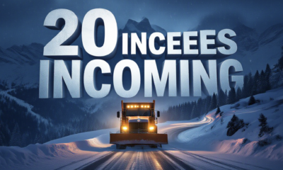 A viral, hyper-realistic YouTube thumbnail with a dramatic winter storm atmosphere. The background is a dark, swirling blizzard over Colorado's jagged mountain peaks at night with heavy snowfall and blowing snow illuminated by vehicle headlights on a winding pass. The composition uses a low-angle shot to focus on the main subject: a massive illuminated orange CDOT snowplow pushing through deep snow on a mountain highway. The image features massive 3D typography with strict hierarchy: The Primary Text reads exactly: '20 INCHES INCOMING'. This text is massive, the largest element in the frame, rendered in glowing ice-blue chrome with frozen frost effects to look like a high-budget 3D render. The Secondary Text reads exactly: 'Colorado Storm Hits Hard'. This text is significantly smaller, positioned below the main text. It features a thick, bright orange border/outline (sticker style) to contrast against the dark stormy background. Make sure text 2 is always different theme, style, effect and border compared to text 1. The text materials correspond to the story's concept. Crucial Instruction: There is absolutely NO other text, numbers, watermarks, or subtitles in this image other than these two specific lines. 8k, Unreal Engine 5, cinematic render