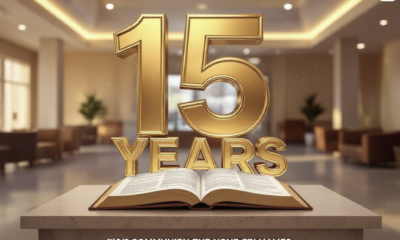 A viral, hyper-realistic YouTube thumbnail with a Civic and Warm atmosphere. The background is a blurred, modern community center interior with soft, golden hour lighting. The composition uses a slightly Low Angle to focus on the main subject: a stylized, 3D Open Book made of polished stone and glass resting on a podium. The image features massive 3D typography with strict hierarchy: The Primary Text reads exactly: '15 YEARS'. This text is massive, the largest element in the frame, rendered in Gold Chrome to look like a high-budget 3D render. The Secondary Text reads exactly: 'COMMUNITY HUB'. This text is significantly smaller, positioned below or next to the main text. It features a thick, distinct white border/outline (sticker style) to contrast against the background. Make sure text 2 is always different theme, style, effect and border compared to text 1.
