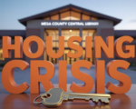 A viral, hyper-realistic YouTube thumbnail with a Business/Community atmosphere. The background is a blurred, high-quality shot of the Mesa County Central Library exterior at twilight with warm, inviting lighting. The composition uses a slightly Low Angle to focus on the main subject: a detailed 3D House Key resting on a wooden table. The image features massive 3D typography with strict hierarchy: The Primary Text reads exactly: 'HOUSING CRISIS'. This text is massive, the largest element in the frame, rendered in Matte Orange to look like a high-budget 3D render. The Secondary Text reads exactly: 'SPEAK UP TONIGHT'. This text is significantly smaller, positioned below the main text. It features a thick, distinct white border/outline (sticker style) to contrast against the background. Make sure text 2 is always different theme, style, effect and border compared to text 1.