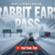 A viral, hyper-realistic YouTube thumbnail with a dramatic winter storm atmosphere. The background is a blinding whiteout blizzard raging across Rabbit Ears Pass with massive snowdrifts burying Highway 40 signs and semi trucks struggling through zero-visibility conditions with swirling snow and ice particles filling the air under dark steel-gray skies. The composition uses a low-angle dramatic shot looking up the snow-covered mountain pass to emphasize power and danger. The main subject: a massive wall of blowing snow completely engulfing the famous Rabbit Ears rock formation. The image features massive 3D typography with strict hierarchy: The Primary Text reads exactly: 'COLORADO STORM'. This text is massive, the largest element in the frame, rendered in icy blue chrome with thick frost and snow accumulation to look like a high-budget 3D render. The Secondary Text reads exactly: 'UP TO 20" SNOW'. This text is significantly smaller, positioned below the main text with a bright orange glowing border and subtle fire-like edge effect to contrast against the cold background. Make sure text 2 is always different theme, style, effect and border compared to text 1. The text materials correspond to the story's concept. Crucial Instruction: There is absolutely NO other text, numbers, watermarks, or subtitles in this image other than these two specific lines. 8k, Unreal Engine 5, cinematic render