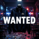 A viral, hyper-realistic YouTube thumbnail with a dark, tense crime atmosphere. The background is the dimly lit interior of a Colorado bar at night with scattered chairs, spilled drinks, and red-blue police lights flashing through windows. The composition uses a dramatic low angle to focus on the main subject: a black quarter-zip Navy pullover hanging ominously in the foreground, the U.S. Navy emblem glowing under harsh spotlight. The image features massive 3D typography with strict hierarchy: The Primary Text reads exactly: 'WANTED'. This text is massive, the largest element in the frame, rendered in cold brushed steel with red
