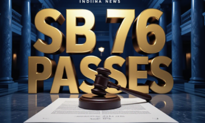 A viral, hyper-realistic YouTube thumbnail with a tense Political News atmosphere. The background is a dramatic, low-angle shot of the Indiana Statehouse interior with marble columns and shadowy hallways, lit with stark, cold blue and amber studio lighting. The composition uses a Low Angle to focus on the main subject: a detailed Faceless Wooden Gavel resting on a polished document. The image features massive 3D typography with strict hierarchy: The Primary Text reads exactly: 'SB 76 PASSES'. This text is massive, the largest element in the frame, rendered in Gold Chrome to look like a high-budget 3D render. The Secondary Text reads exactly: 'MANDATORY ICE COMPLIANCE'. This text is significantly smaller, positioned below the main text. It features a thick, distinct red border/outline (sticker style) to contrast against the background. Make sure text 2 is always different theme, style, effect and border compared to text 1. The text materials correspond to the story's concept. Crucial Instruction: There is absolutely NO other text, numbers, watermarks, or subtitles in this image other than these two specific lines. 8k, Unreal Engine 5, cinematic render