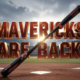 A viral, hyper-realistic YouTube thumbnail with a kinetic college baseball atmosphere. The background is a packed mountain-west stadium under dramatic gray winter clouds with sharp Rocky Mountain peaks in the distance and golden afternoon light cutting through. The composition uses a dramatic low angle to focus on the main subject: a gleaming black and red baseball bat planted firmly in the dirt like a sword. The image features massive 3D typography with strict hierarchy: The Primary Text reads exactly: 'MAVERICKS ARE BACK'. This text is massive, the largest element in the frame, rendered in molten chrome red with glowing edges to look like a high-budget 3D render. The Secondary Text reads exactly: '11-9 OPENING DAY THRILLER'. This text is significantly smaller, positioned below the main text. It features a thick white border with black outline sticker style to contrast against the background. Make sure text 2 is always different theme, style, effect and border compared to text 1. The text materials correspond to the story's concept. Crucial Instruction: There is absolutely NO other text, numbers, watermarks, or subtitles in this image other than these two specific lines. 8k, Unreal Engine 5, cinematic render