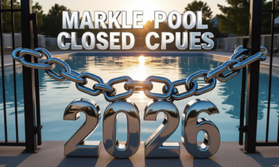 A viral, hyper-realistic YouTube thumbnail with a bittersweet summer vibe atmosphere. The background is a beautiful but empty small-town swimming pool at golden hour, water perfectly still, late-summer sunlight sparkling on the surface. The composition uses a dramatic low-angle shot from the deep end looking toward the locked front gate. The main subject: a massive, gleaming chrome 3D chain and padlock wrapped around the gate. The image features massive 3D typography with strict hierarchy: The Primary Text reads exactly: 'MARKLE POOL CLOSED 2026'. This text is massive, the largest element in the frame, rendered in polished chrome metal with realistic reflections of the pool water. The Secondary Text reads exactly: 'BIG RENOVATIONS COMING'. This text is significantly smaller, positioned below the main text with a thick electric-blue glowing outline and subtle motion blur to make it pop against the warm sunset sky. 8k, Unreal Engine 5, cinematic render