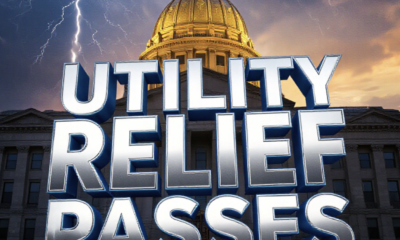 A viral, hyper-realistic YouTube thumbnail with a dramatic Statehouse atmosphere. The background is the golden-hour Indiana Statehouse dome glowing against a stormy sky with subtle lightning cracks symbolizing rate shocks. The composition uses a low-angle heroic shot to focus on the main subject: a massive, weathered utility bill paper torn in half floating in mid-air. The image features massive 3D typography with strict hierarchy: The Primary Text reads exactly: 'UTILITY RELIEF PASSES'. This text is massive, the largest element in the frame, rendered in polished chrome with electric blue glow edges to look like a high-budget 3D render. The Secondary Text reads exactly: 'Low-Income Hoosiers Win Big'. This text is significantly smaller, positioned below the main text. It features a thick, glowing red border/outline (sticker style) to contrast against the background. Make sure text 2 is always different theme, style, effect and border compared to text 1. The text materials correspond to the story's concept. Crucial Instruction: There is absolutely NO other text, numbers, wate