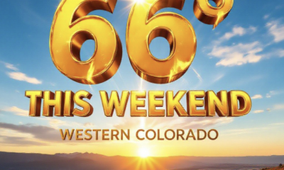 A viral, hyper-realistic YouTube thumbnail with a bright, golden-hour autumn atmosphere. The background is a sweeping panoramic view of the Grand Mesa and Colorado National Monument bathed in warm sunset light with clear blue skies above. The composition uses a dramatic low-angle shot looking up at massive 3D typography floating in the sky. The Primary Text reads exactly: '66° THIS WEEKEND'. This text is massive, rendered in glowing molten gold with realistic light rays bursting through the letters like a high-budget cinematic render. The Secondary Text reads exactly: 'Western Colorado'. This text is smaller, positioned below in bold white with thick red outline sticker style. Crucial Instruction: There is absolutely NO other text, numbers, watermarks, or subtitles in this image other than these two specific lines. 8k, Unreal Engine 5, cinematic render