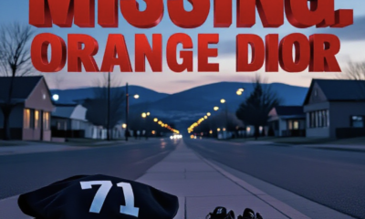 A viral, hyper-realistic YouTube thumbnail with a somber urgent atmosphere. The background is a quiet residential street in small town Cortez Colorado at dusk with distant mesas and soft street lighting. The composition uses a low angle to focus on the main subject: a black sweatshirt with the number 71 on the back lying folded on a concrete sidewalk next to black and white Nike shoes. The image features massive 3D typography with strict hierarchy: The Primary Text reads exactly: 'MISSING: ORANGE DIOR'. This text is massive, the largest element in the frame, rendered in bold red metallic with distressed edges to look like a high-budget 3D render. The Secondary Text reads exactly: '13, LAST SEEN CORTEZ'. This text is significantly smaller, positioned below the main text. It features a thick yellow border/outline (sticker style) to contrast against the background. Make sure text 2 is always different theme, style, effect and border compared to text 1.