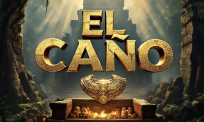 A viral, hyper-realistic YouTube thumbnail with a mysterious ancient temple atmosphere. The background is a misty Panama jungle at golden hour with dramatic shafts of light cutting through massive ceiba trees and faint stone monoliths covered in moss. The composition uses a dramatic low-angle shot to focus on the main subject: a gleaming pre-Columbian gold breastplate with embossed supernatural creature floating above an open tomb filled with glowing ceramics and whale-tooth ivory. Image size should be 3:2. The image features massive 3D typography with strict hierarchy: The Primary Text reads exactly: 'EL CAÑO GOLD'. This text is massive, the largest element in the frame, rendered in molten liquid gold with realistic drips and reflections to look like a high-budget 3D render. The Secondary Text reads exactly: 'Richest Tomb Ever Found'. This text is significantly smaller, positioned below the main text with a thick electric-blue glowing border and subtle lightning effect to contrast against the background. Make sure text 2 is always different theme, style, effect and border compared to text 1. The text materials correspond to the story's concept. Crucial Instruction: There is absolutely NO other text, numbers, watermarks, or subtitles in this image other than these two specific lines. 8k, Unreal Engine 5, cinematic render