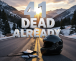 A viral, hyper-realistic YouTube thumbnail with a dramatic kinetic mountain highway atmosphere. The background is a twisting Colorado mountain pass at golden hour with lingering snow patches and loose gravel scattered on the asphalt, dramatic god rays cutting through pine trees. The composition uses a low dramatic camera angle to focus on the main subject: a lone abandoned full-face helmet lying cracked on the yellow center line with tire skid marks leading away. Image size should be 3:2. The image features massive 3D typography with strict hierarchy: The Primary Text reads exactly: '41 DEAD ALREADY'. This text is massive, the largest element in the frame, rendered in dripping blood-red chrome to look like a high-budget 3D render. The Secondary Text reads exactly: 'Colorado 2024'. This text is significantly smaller, positioned below the main text. It features a thick white glow border with cracked texture to contrast against the dark road. 8k, Unreal Engine 5, cinematic render