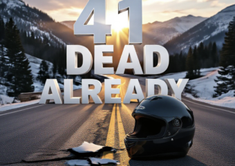 A viral, hyper-realistic YouTube thumbnail with a dramatic kinetic mountain highway atmosphere. The background is a twisting Colorado mountain pass at golden hour with lingering snow patches and loose gravel scattered on the asphalt, dramatic god rays cutting through pine trees. The composition uses a low dramatic camera angle to focus on the main subject: a lone abandoned full-face helmet lying cracked on the yellow center line with tire skid marks leading away. Image size should be 3:2. The image features massive 3D typography with strict hierarchy: The Primary Text reads exactly: '41 DEAD ALREADY'. This text is massive, the largest element in the frame, rendered in dripping blood-red chrome to look like a high-budget 3D render. The Secondary Text reads exactly: 'Colorado 2024'. This text is significantly smaller, positioned below the main text. It features a thick white glow border with cracked texture to contrast against the dark road. 8k, Unreal Engine 5, cinematic render