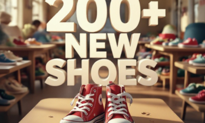 A viral, hyper-realistic YouTube thumbnail with a warm, golden community atmosphere. The background is the interior of Pathways Family Shelter filled with tables of colorful new shoes and soft afternoon light streaming through windows. The composition uses a low, slightly wide angle to focus on the main subject: a pair of bright red children's high-top sneakers placed proudly on a shelter table with tiny feet prints leading up to them. Image size should be 3:2. The image features massive 3D typography with strict hierarchy: The Primary Text reads exactly: '200+ NEW SHOES'. This text is massive, the largest element in the frame, rendered in glowing gold chrome to look like a high-budget 3D render. The Secondary Text reads exactly: 'FOR KIDS IN NEED'. This text is significantly smaller, positioned below the main text with a thick white outline and red sticker-style border to pop against the background. The text materials correspond to the story's concept. Crucial Instruction: There is absolutely NO other text, numbers, watermarks, or subtitles in this image other than these two specific lines. 8k, Unreal Engine 5, cinematic render.
