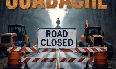 A viral, hyper-realistic YouTube thumbnail with a rugged Indiana outdoors atmosphere. The background is a misty early-spring forest road blocked by orange construction barriers and heavy equipment, with the historic CCC statue barely visible through the trees. The composition uses a dramatic low-angle shot looking up the closed entrance road to focus on the main subject: a massive, weathered "ROAD CLOSED" sign on steel barricades. Image size should be 3:2. The image features massive 3D typography with strict hierarchy: The Primary Text reads exactly: 'Ouabache Closed'. This text is massive, the largest element in the frame, rendered in weathered rust-orange steel to look like a high-budget 3D render. The Secondary Text reads exactly: 'Detour Starts Now'. This text is significantly smaller, positioned below the main text. It features a thick, glowing white border/outline (sticker style) to contrast against the background. Make sure text 2 is always different theme, style, effect and border compared to text 1.