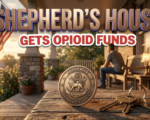 A viral, hyper-realistic YouTube thumbnail with a warm, hopeful recovery atmosphere. The background is the softly lit porch of a modest brick recovery house at golden hour, American flag gently waving. The composition uses a low-angle heroic shot to focus on the main subject: a polished bronze military challenge coin resting on a worn wooden table with a set of house keys beside it. Image size should be 3:2. The image features massive 3D typography with strict hierarchy: The Primary Text reads exactly: 'SHEPHERD’S HOUSE'. This text is massive, the largest element in the frame, rendered in brushed bronze metal with subtle patriotic red-white-blue edge glow to look like a high-budget 3D render. The Secondary Text reads exactly: 'GETS OPIOID FUNDS'. This text is significantly smaller, positioned below the main text. It features a thick white sticker-style outline with slight red shadow to contrast against the warm background. Make sure text 2 is always different theme, style, effect and border compared to text 1.