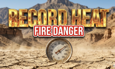 A viral, hyper-realistic YouTube thumbnail with a Hazardous Weather atmosphere. The background is a dry, sun-drenched Colorado canyon landscape with heat waves visible and dust blowing in the wind. The composition uses a Low Angle to focus on the main subject: a weathered, vintage outdoor thermometer stuck in cracked earth. Image size should be 3:2. The image features massive 3D typography with strict hierarchy: The Primary Text reads exactly: 'RECORD HEAT'. This text is massive, the largest element in the frame, rendered in Molten Gold to look like a high-budget 3D render. The Secondary Text reads exactly: 'FIRE DANGER'. This text is significantly smaller, positioned below or next to the main text. It features a thick, distinct color border/outline (sticker style) to contrast against the background. Make sure text 2 is always different theme, style, effect and border compared to text 1.
