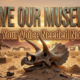 A viral, hyper-realistic YouTube thumbnail with a warm western heritage atmosphere. The background is a dramatic Colorado sunset over red rock mesas with glowing museum silhouettes in Grand Junction and Fruita. The composition uses a low-angle cinematic shot to focus on the main subject: a massive, weathered triceratops skull emerging from the sand. Image size should be 3:2. The image features massive 3D typography with strict hierarchy: The Primary Text reads exactly: 'SAVE OUR MUSEUMS'. This text is massive, the largest element in the frame, rendered in burnished bronze metal with authentic patina to look like a high-budget 3D render. The Secondary Text reads exactly: 'Your Voice Needed Now'. This text is significantly smaller, positioned below the main text. It features a thick, glowing orange outline with subtle dust particles to contrast against the background. Make sure text 2 is always different theme, style, effect and border compared to text 1.