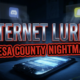 A viral, hyper-realistic YouTube thumbnail with a dark cyber-crime atmosphere. The background is a shadowy bedroom at night lit only by harsh blue phone screen glow, with faint Discord and Snapchat windows floating in the air like ghosts. The composition uses a dramatic low-angle shot to focus on the main subject: a cracked smartphone lying face-up on a child’s bed with glowing predator messages on screen. Image size should be 3:2. The image features massive 3D typography with strict hierarchy: The Primary Text reads exactly: 'INTERNET LURING'. This text is massive, the largest element in the frame, rendered in cold chrome metal with sharp red glowing edges to look like a high-budget 3D render. The Secondary Text reads exactly: 'MESA COUNTY NIGHTMARE'. This text is significantly smaller, positioned below the main text. It features a thick, blood-red border/outline (sticker style) to contrast against the background. Make sure text 2 is always different theme, style, effect and border compared to text 1. The text materials correspond to the story's concept. Crucial Instruction: There is absolutely NO other text, numbers, watermarks, or subtitles in this image other than these two specific lines. 8k, Unreal Engine 5, cinematic render
