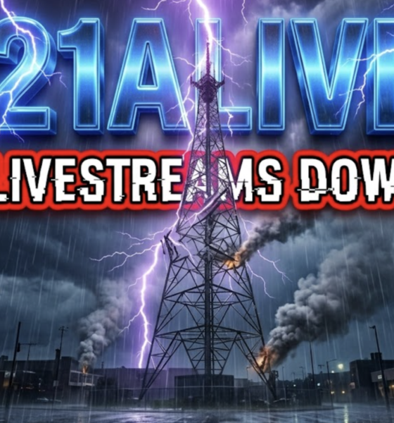 A viral, hyper-realistic YouTube thumbnail with a dramatic storm/news atmosphere. The background is a dark, chaotic night sky over Fort Wayne with intense purple lightning strikes and heavy rain pouring down on the 21Alive transmission tower that's visibly damaged and sparking. The composition uses a dramatic low-angle shot to focus on the main subject: a twisted, lightning-struck broadcast tower with smoke rising. Image size should be 3:2. The image features massive 3D typography with strict hierarchy: The Primary Text reads exactly: '21ALIVE'. This text is massive, the largest element in the frame, rendered in glowing electric blue chrome with crackling lightning effects to look like a high-budget 3D render. The Secondary Text reads exactly: 'LIVESTREAMS DOWN'. This text is significantly smaller, positioned below the main text. It features a thick, bright red border/outline (sticker style) with glitch distortion effect to contrast against the stormy background. Make sure text 2 is always different theme, style, effect and border compared to text 1.