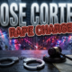 A viral, hyper-realistic YouTube thumbnail with a serious crime reporting atmosphere. The background is a dimly lit Fort Wayne cityscape at night with police emergency lights casting red and blue reflections across wet pavement and urban buildings. The composition uses a low angle to focus on the main subject: a pair of metallic handcuffs resting on official court documents with a gavel beside them, all on a dark wooden surface. Image size should be 3:2. The image features massive 3D typography with strict hierarchy: The Primary Text reads exactly: 'JOSE CORTEZ'. This text is massive, the largest element in the frame, rendered in cold metallic steel with police badge texture to look like a high-budget 3D render. The Secondary Text reads exactly: 'RAPE CHARGE'. This text is significantly smaller, positioned below the main text. It features a thick, distinct red border/outline in sticker style to contrast against the background. Make sure text 2 is always different theme, style, effect and border compared to text 1. The text materials correspond to the story's concept. Crucial Instruction: There is absolutely NO other text, numbers, watermarks, or subtitles in this image other than these two specific lines. 8k, Unreal Engine 5, cinematic render.